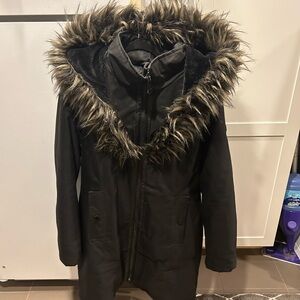 Black warm winter jacket. Long to the knees.